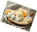 A plate of cheese on a wood surface

AI-generated content may be incorrect.